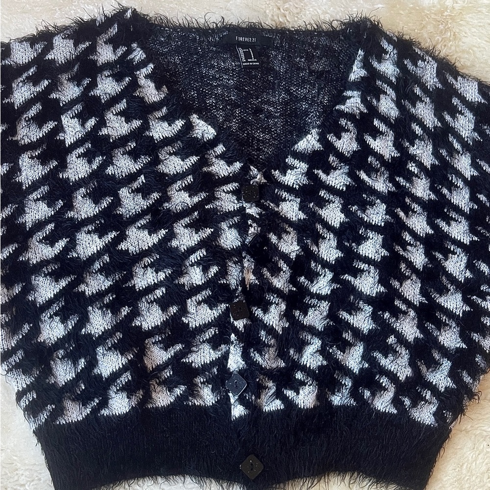 This is a black and white, button up, and cropped sweater from forever 21.